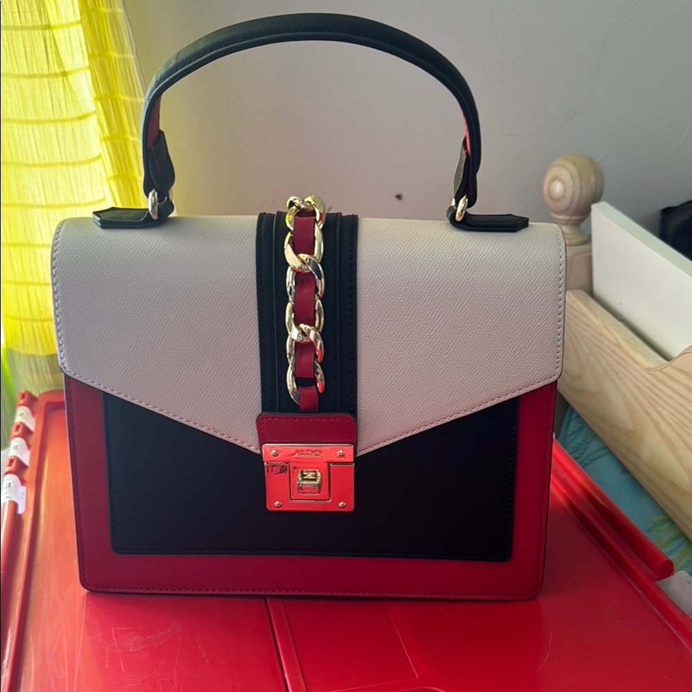 Aldo Red and Black Satchel with Chunky Gold Chain Embellishment